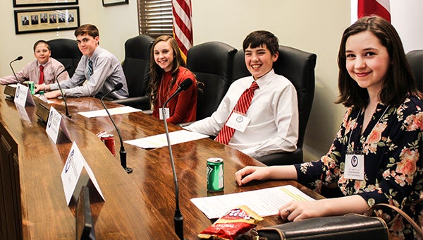 Seven eighth-grade students learned first-hand about the roles of city leaders on Tuesday as they participated in the City of Troy’s Mayor for a Day program. Above, from left, J.D. Wilson, John Baxley Sanders, Sophie Hollis Scott Taylor Renfroe and Anna Robinson served as representatives of the five districts. 