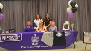 Messenger Photo/mike hensley Laken Maulden with her family and coaches during her scholarship signing at Pike County High School on Friday afternoon.