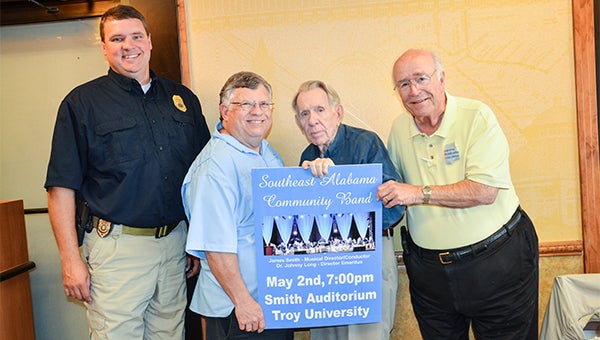 Dr. Johnny Long is the founder of the band and conducted the band for 12 years. James Smith now conducts the band. John Michael McCall, Chief of University police, and Ralph Black, are band members. Pictured from left, McCall, Smith, Long and Black. 