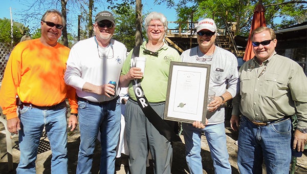 Bill Horn, Pat Harris, Mayor Keith Roling, Greg Pappas and Andrew Brown posed during Sunday’s service recognizing Roling as the official “Mayor of Orion.” The group gathers each month at the Orion Hunt and Social Club, and Roling’s role in coordinating the events was recognized by the Alabama Senate. Inset below, Harris presents the resolution to Rolling and, at bottom, Booty Bruce and Gerald Boswell join Booty’s wife and daughter.