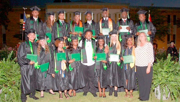 Sixteen students in the Business and Finance Academy at Pike County High School graduated from Enterprise State Community College on May 12. They will graduate high school on May 26. Pictured, front from left, Mike Bonner, Marley Duncan, Kierra Patterson, Shanetta Cochran, Trey Wilson, Chandia Taylor, Laken Maulden, Diamond Pickett, Sharon Denison-Director, Academy of Business & Finance. Back row:  Kamari Jackson, Taylor Ward, Xavier Allen, Chelsey Holland, Gregory Toney, Jerrell Lawson, Deshon Cowling, Anfernee Feagin. Not pictured:  Andrew Chance, Jasmine Paxton, Davia Terry, TriChina Vaughn.