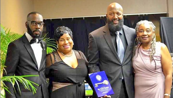 Tracy Martin, father of the late Trayvon Martin, was presented a key to the City of Troy. Pictured are, from left, Willie B. Williams Jr. and Shelia Jackson, both of the City of Troy Tourism Office, Martin and Dejerilyn King Henderson, District 5 Councilwoman. 