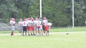 Messenger Photo/Mike Hensley Head coach Gene Allen talking with his defense during practice on Wednesday. The Patriots will take part in the Kingwood Jamboree on Friday night.