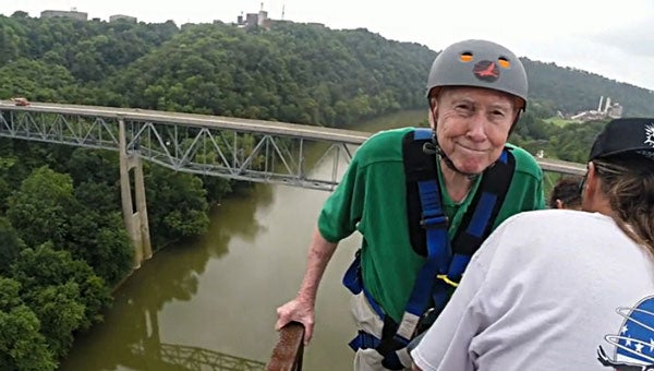 Ninety-year-old, Bill Dillard, born in Troy, prepares for a 240-foot bungee jump from Young’s High Bridge. 