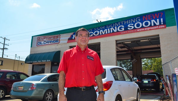 Chris Nonnenmann, owner of Express Oil Change, is expanding his business from two bays to eight and making it a full-service station. Above, Nonnenmann is pictured in front of the current building. 