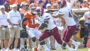Photo/troy athletics Jabir Frye runs the ball for the Trojans against Clemson on Saturday afternoon. Frye and the Trojans lost by six points against the second ranked Clemson Tigers. They will be back in action on Saturday when they travel to take on Southern Mississippi.