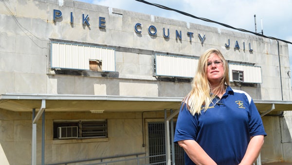 Jail administrator Kelley Barron stands in front of Pike County Jail. Barron agreed with Sheriff Russell Thomas about the need for a new jail. “We need it really bad,” she said. 