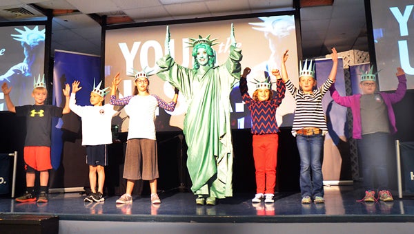 Students at PIke LIberal Arts School welcome Libby Liberty on Monday as they kicked off the annual LIberty’s Legacy program, which teaches about citizenship. The program is sponsored in part by Troy Bank & Trust.