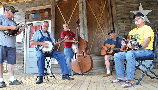 Ole Rex’s Memorial Bluegrass Jamboree doesn’t officially kick off until Thursday night but already picker’s are gathering on the stage of Ole Rex’s Picking Park. Music will be played on stage from 6 until 9 p.m. Friday and Saturday. Jamming will continue until. Pictured from left, Gary Taylor, Brooksville, Fla.; Bobby Jackson, Andalusia; Richard Holmes, Brooksville; Dennis Humphryes, Bessemer; and Al Gonnella, Brooksville. 