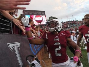 Troy's John Johnson (2) celebrates with fans after an NCAA college football game against Georgia State in Troy, Ala., Saturday, Oct. 15, 2016. Troy won 31-21. (Photo/Thomas Graning)