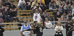 Photo/ Emmanuel Thompson reaches out to grab a pass against Idaho on Saturday afternoon. The Trojans picked up their fourth win of the season last Saturday afternoon when they defeated Idaho. 