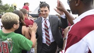 Messenger Photo/thomas graning Trojan head coach Neal Brown greets the fans during Trojan Walk earlier this season. The Trojans put their 7-1 record on the line this Saturday when they take on Appalachian State.