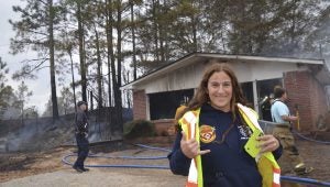 Joceline Tabacco’s cross-country foot journey depends entirely on the kindness and compassion of the strangers she meets along the way. On Monday, that journey brought her through Pike County, where the generosity of firefighters gave her a first-hand look at a brush fire. She said the journey is a walk of faith. 