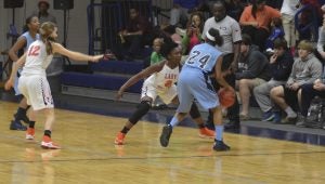 Messenger Photo/mike hensley Niaria Jones guards her player during a game against Barbour County on Tuesday night. Jones and Trojans defeated the Jaguars 67-14.