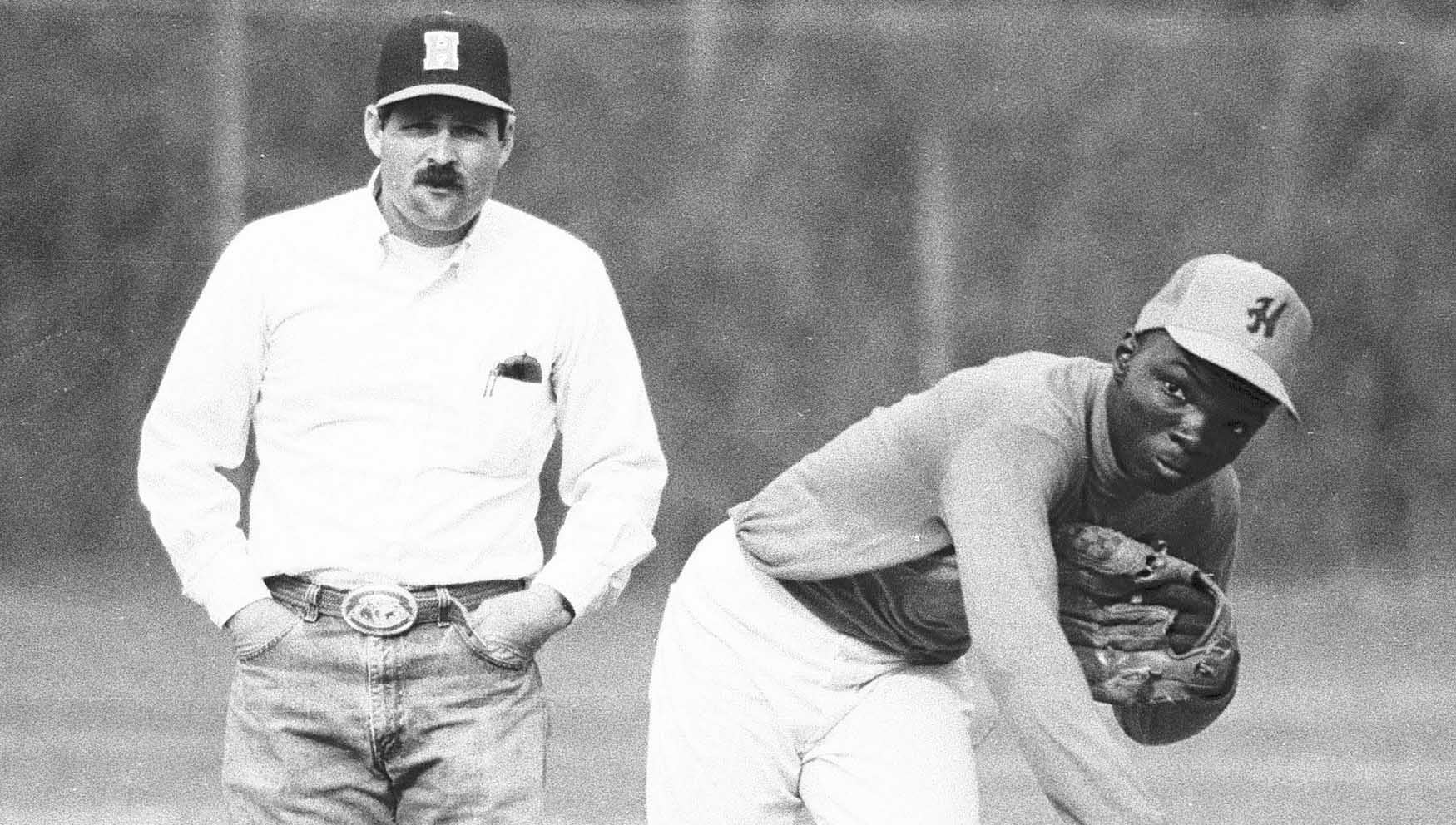 Former CHHS Head Baseball Coach Mike Hogan watches over Will Green in a 1988 team practice.