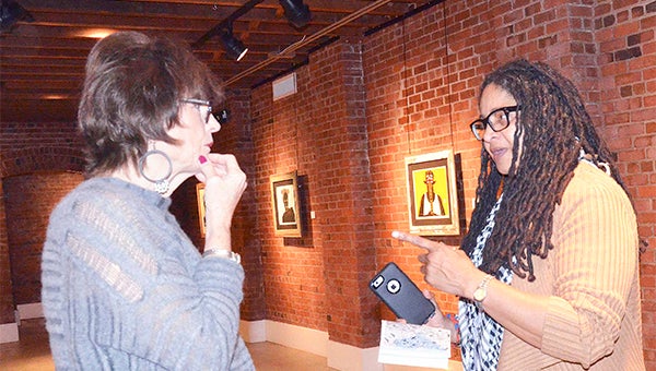 Wiley White visits with artist Debra Riffe during the Art Talk event on Thursday. Inset below, artists Elana Hagler and Belinda Harrison also were on hand for the event. All three have shows on display through the end of February at the Johnson Center for the Arts.
