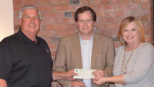 Bill Hopper, chair of the Troy Pike Cultural Arts Center, and Vicki Pritchett, director of the JCA, accepted a $20,000 donation from Jeff Kervin, president of Troy Bank & Trust earlier this week.