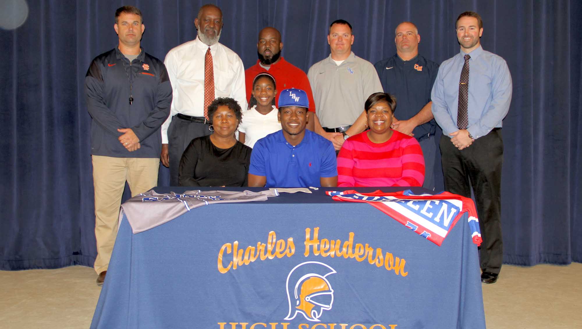Photo/dan smith Bryson Gandy of Charles Henderson High School signed a basbeall scholarship on Tuesday with LBW--Andalusia. Front row, left to right: Ouida Gandy, (grandmother), Bryson Gandy, Lashanda Jackson (mother). Middle row, Gabby Gandy. Back row: CHHS Athletic Director Brad McCoy, Earvie Gandy (grandfather), Gabe Gandy (father), LBW Assistant Coach Brandon Ware, CHHS Baseball Coach Josey Shannon and CHHS Principal Brock Kelly. 