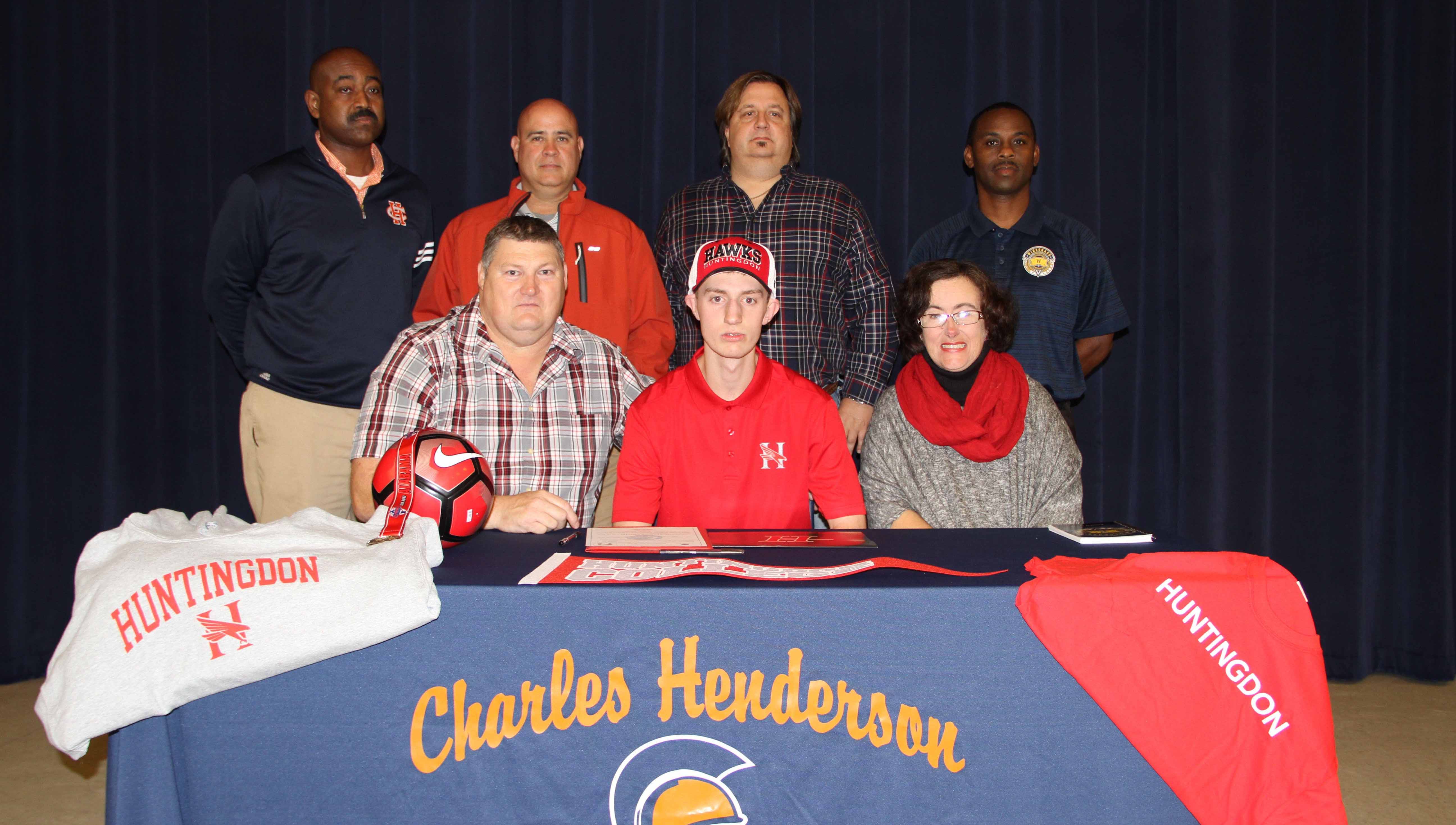 Photo/dan smith Charles Henderson senior Harrison Johnson signed a soccer scholarship with Huntingdon Collge on Friday. Seated left to right, Mr. Allen Johnson, Harrison Johnson and Mrs. Ashley Johnson. Back row, CHHS Assistant Principal Shelby Tuck, CHHS Soccer Coach Rick Vasquez, Olaf Lieb and Wiregrass Futbol Club President Kenneth LeBlanc. 