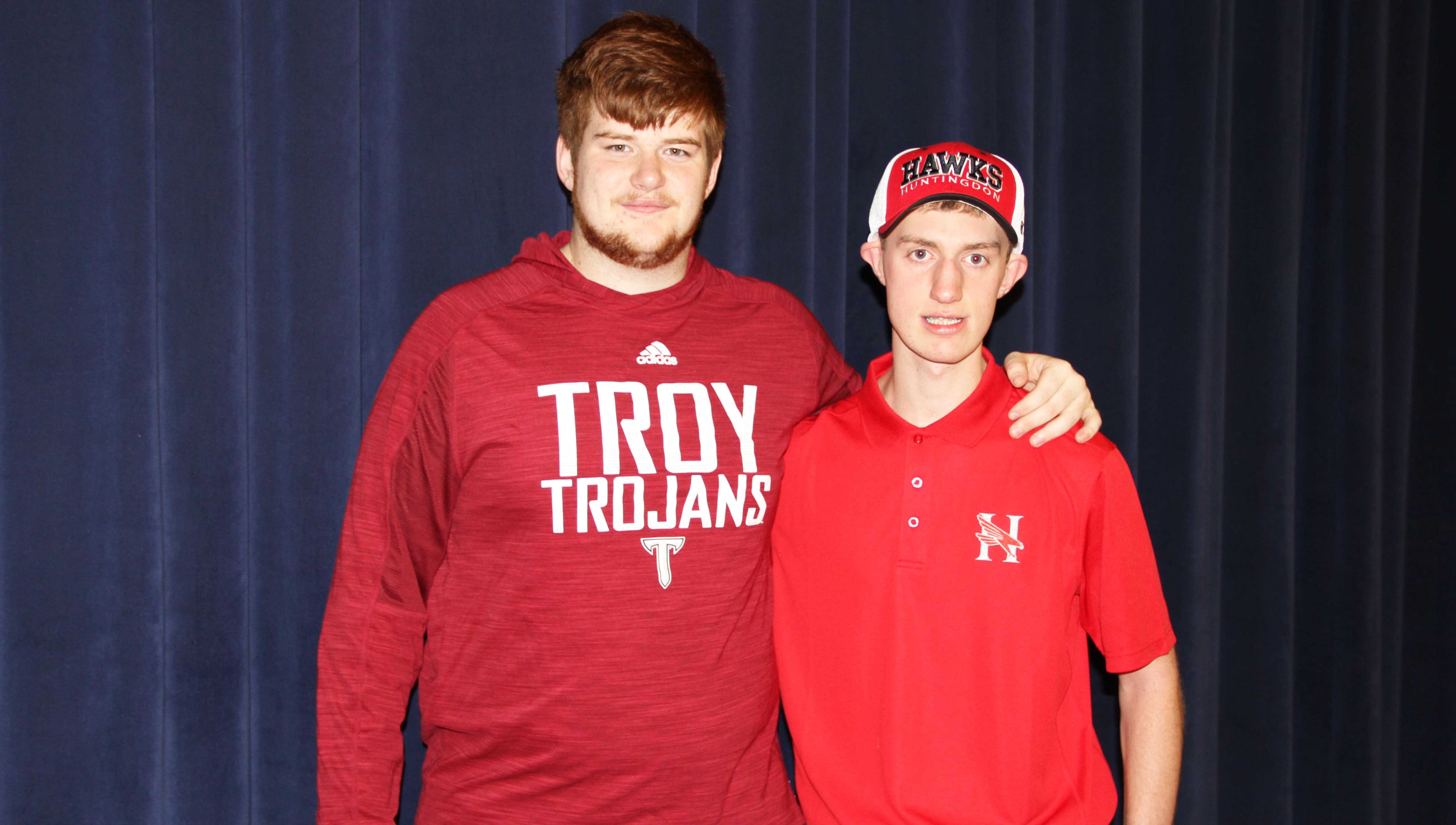 Hunter Kennedy, left, a 2013 graduate of CHHS and all-state offensive lineman, was there for Harrison Johnson’s signing Friday. 