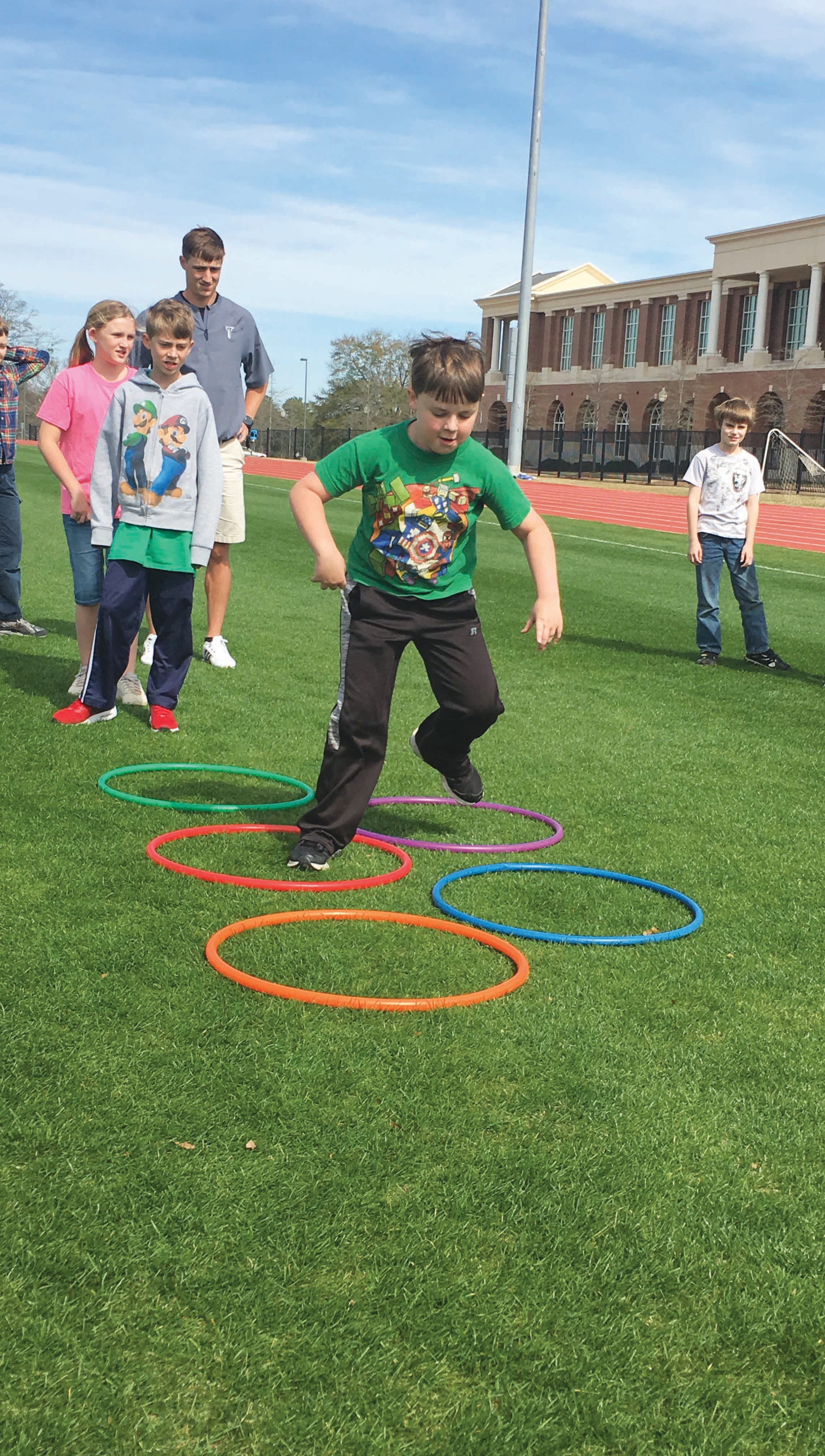 submitted Photo Troy Kinesiology and Health promotion students are getting valuable teaching experience by tutoring local home school students. Local students are learning about track and field, archery and soccer 